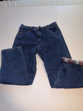 Guide Gear flannel-lined denim jeans featuring a red plaid pattern.